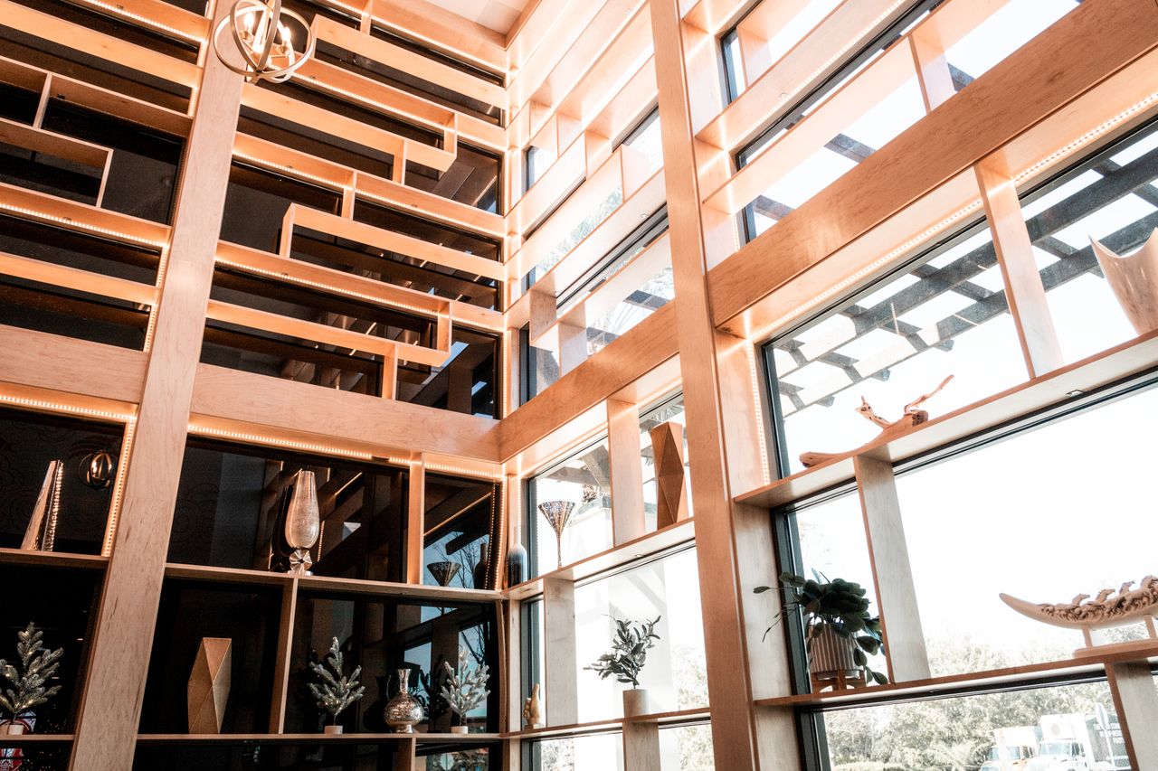 services-02 Stylish interior featuring wooden decor, glass panels, and elegant decor elements in natural light.